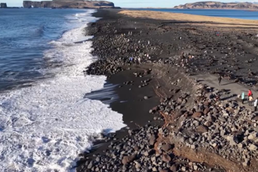 How to Travel Iceland Responsibly: A Guide for Conscious Explorers aerial view of dyrhólaey black sand beach, iceland