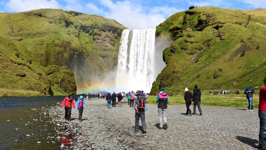 Iceland's overtourism problem: what every traveler needs to know before they go skogafoss waterfall island touristy site