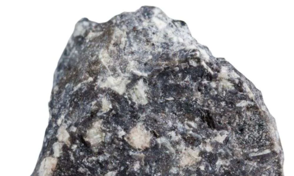Close-up view of a grey andesite rock from Japan, showing porous volcanic texture and fine mineral cavities