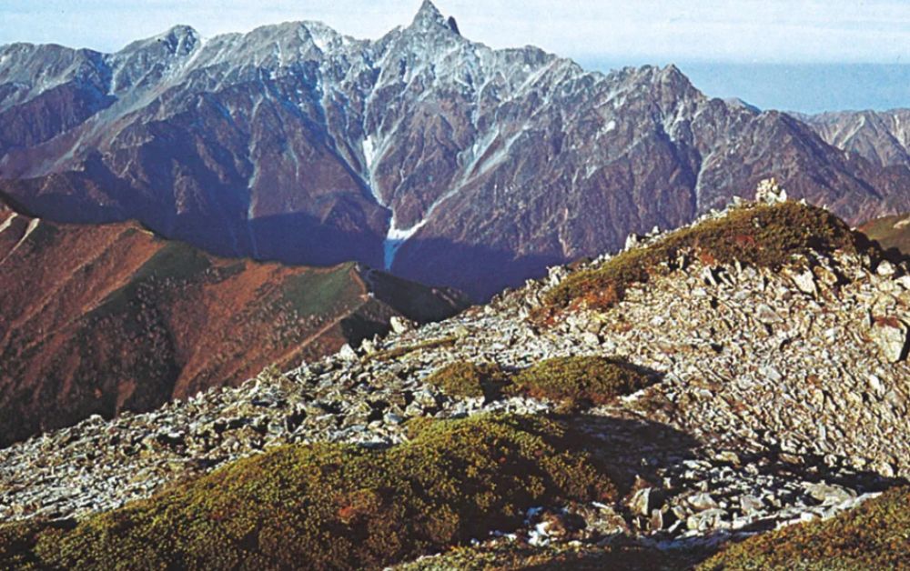 Rugged peaks of the Hida Belt in Japan's Northern Alps, layered ridges shaped by ancient tectonic uplift.
