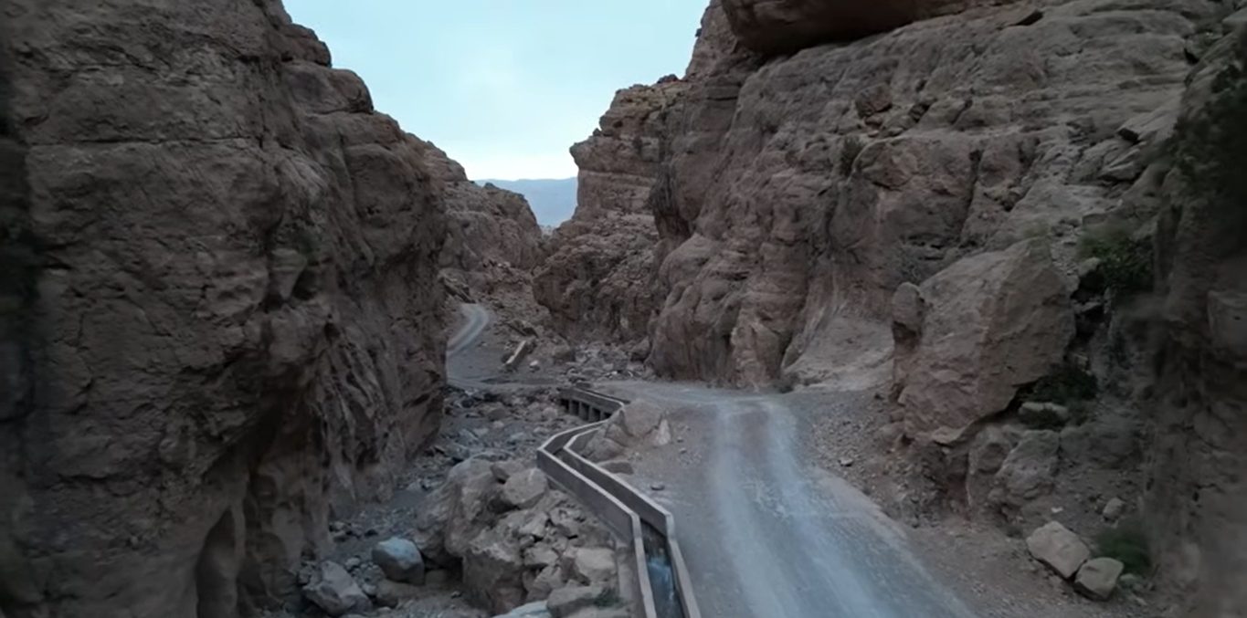 Anti-Atlas road trip: serpentine mountain road carved into a gorge