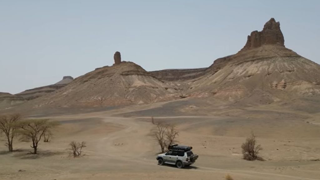 Anti-Atlas road trip: 4x4 driving past desert towers of the Anti-Atlas Mountains