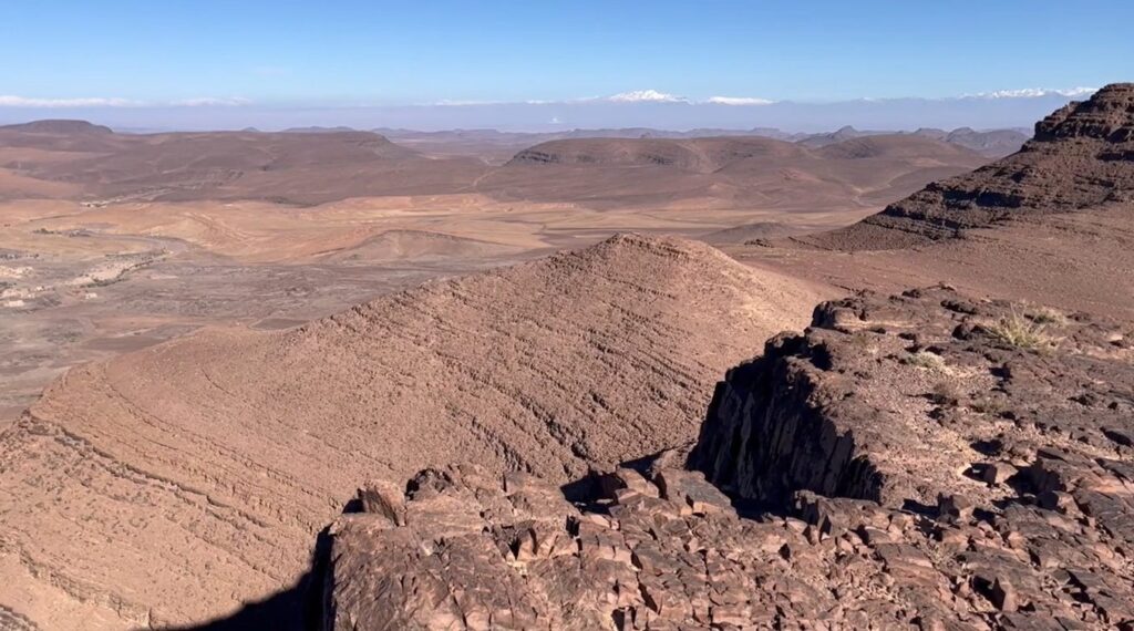 Anti-Atlas geology: panoramic view of red sedimentary strata in southern Morocco
