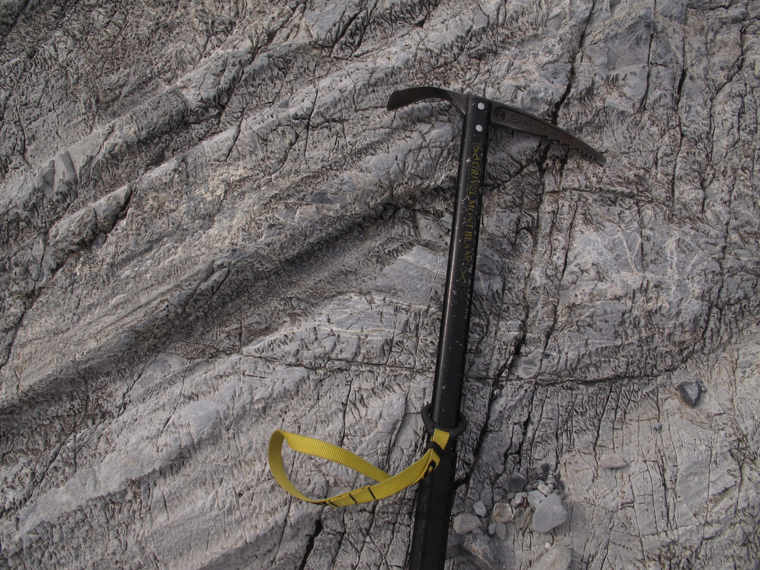 Glacial striations scoured into bedrock, illustrating the same signature mapped along Morocco's Second Bani quartzite ridge
