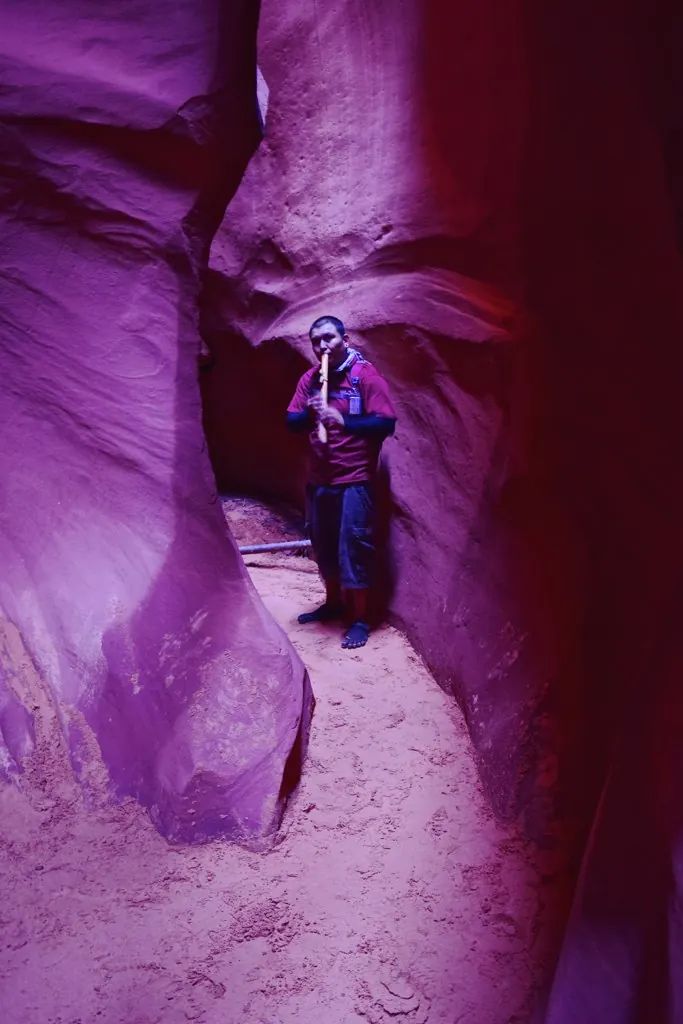 Navajo tour guide inside Antelope Canyon during a guided tour