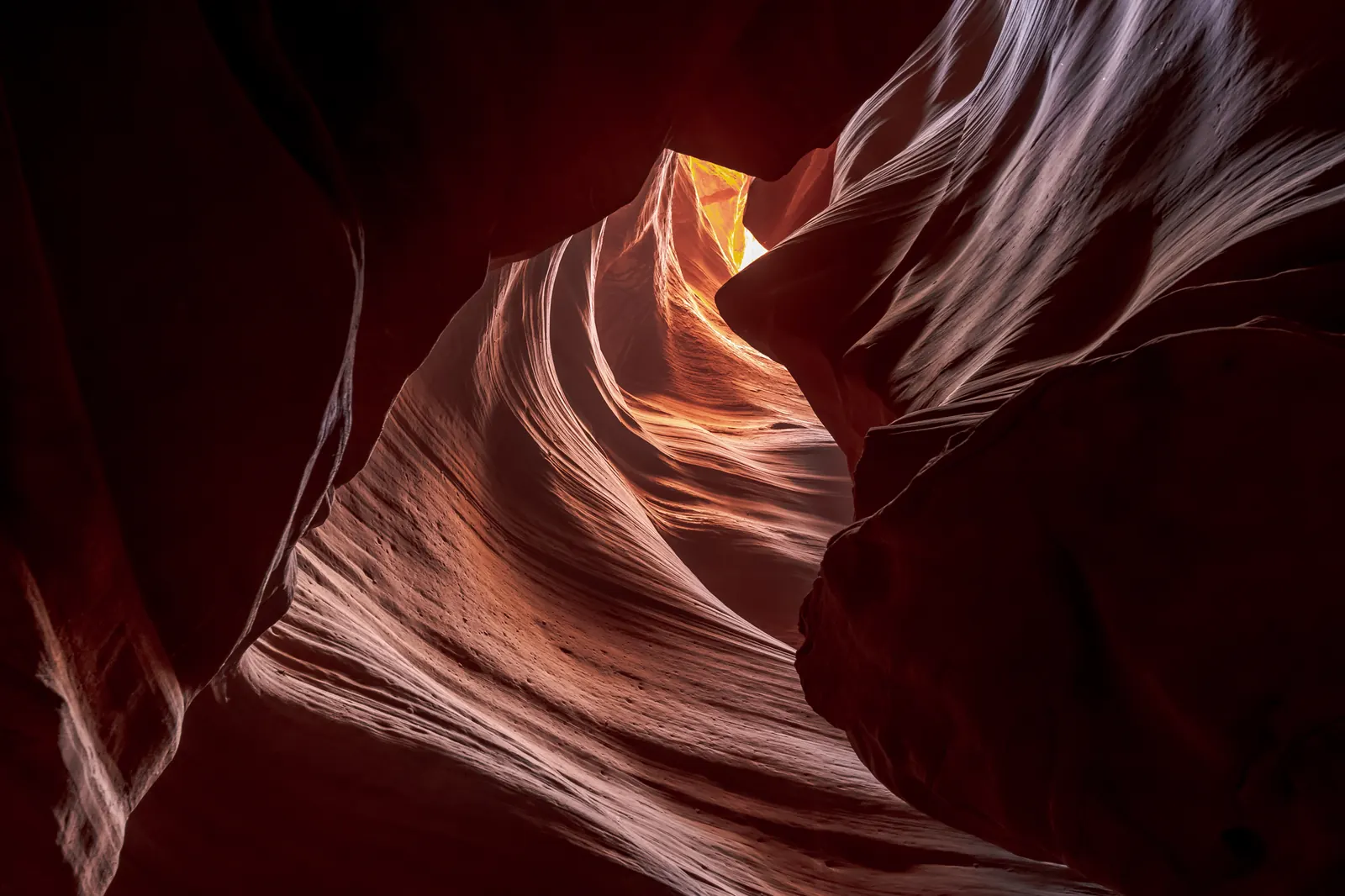 Wide open corridor inside Upper Antelope Canyon with light reaching the floor