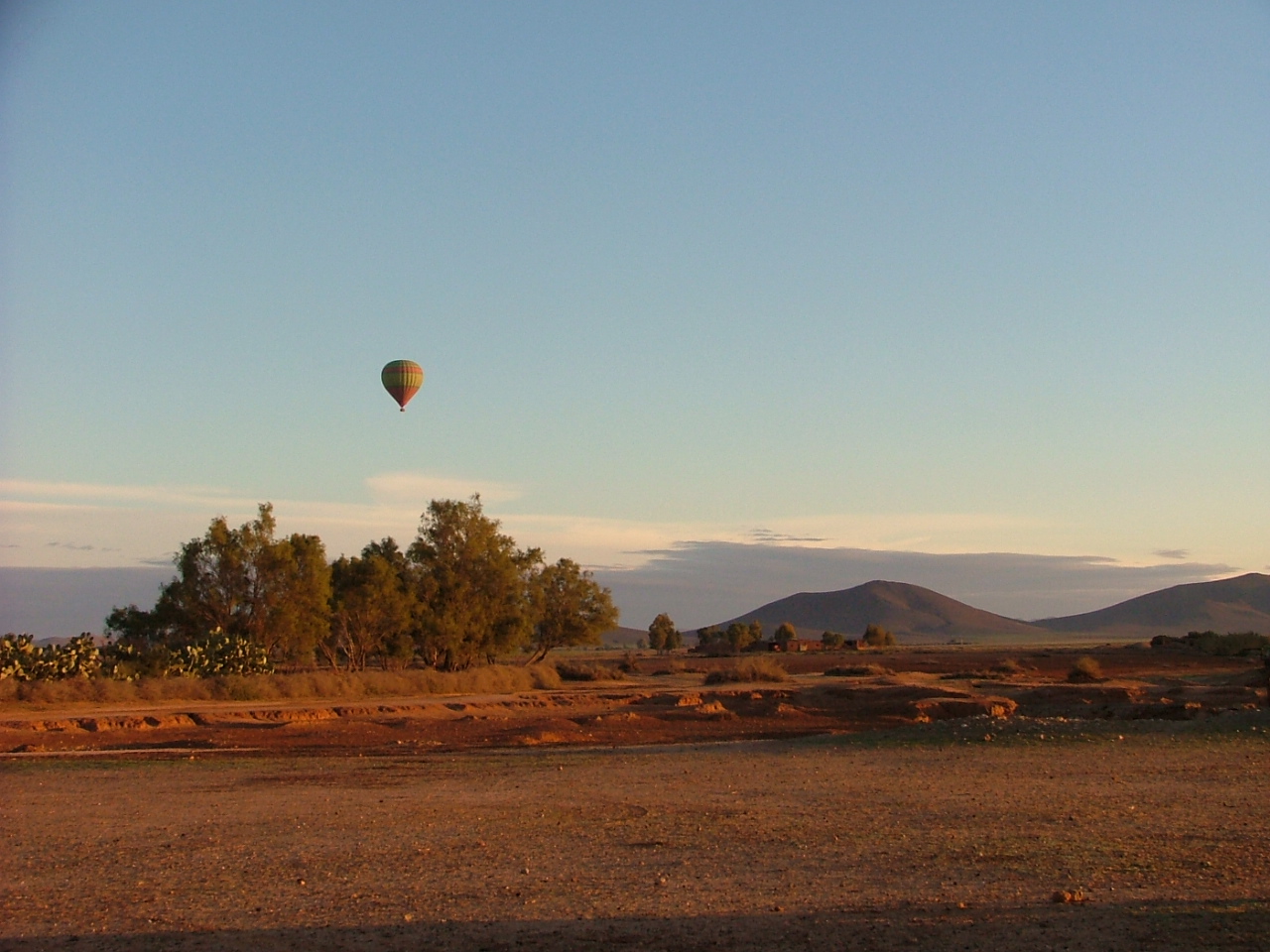 Hot air balloon over the desert near Marrakech at dawn