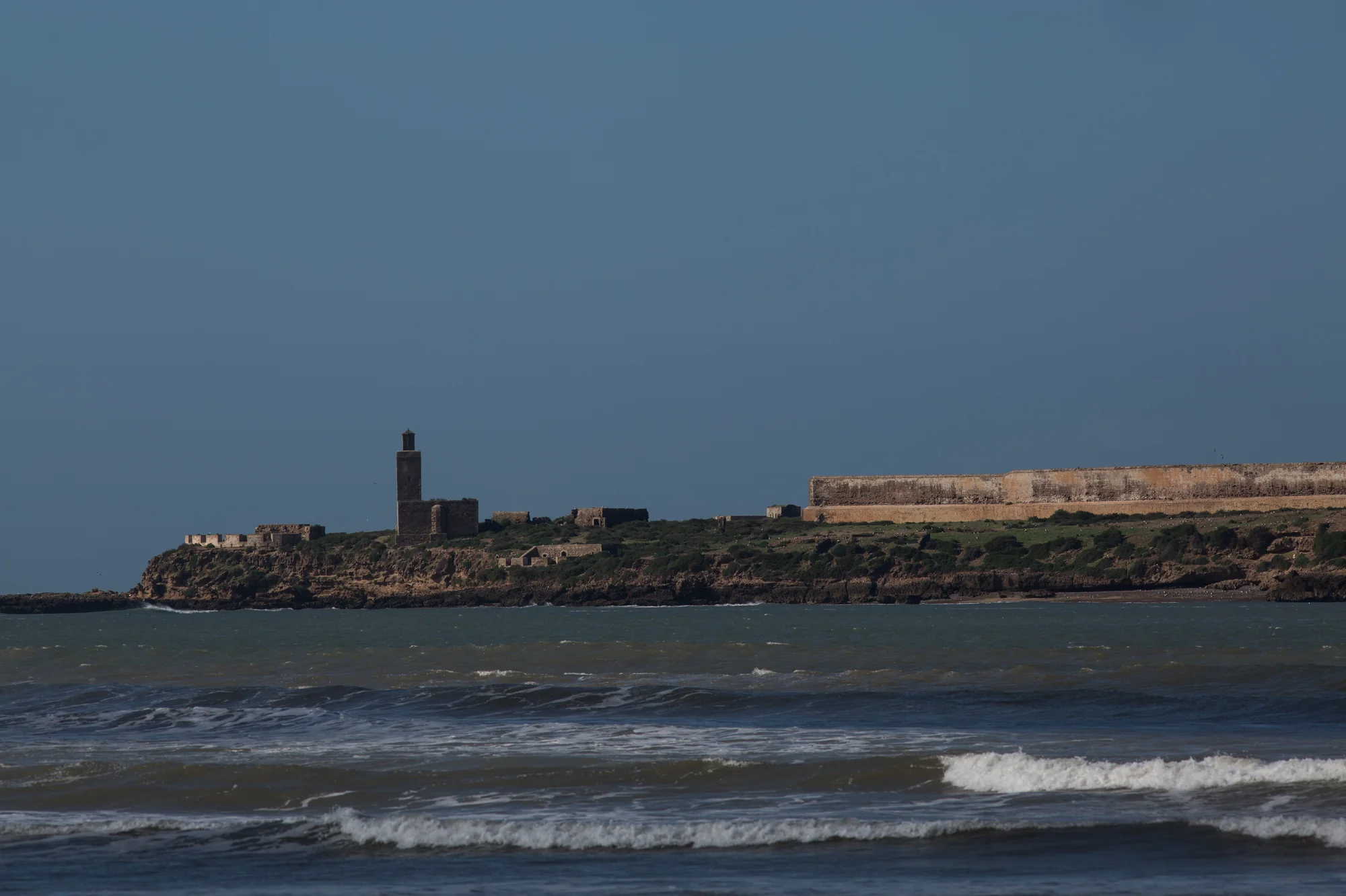 The island of Mogador seen from Essaouira harbor, a hard calcareous sandstone outcrop that shelters the bay from Atlantic erosion.