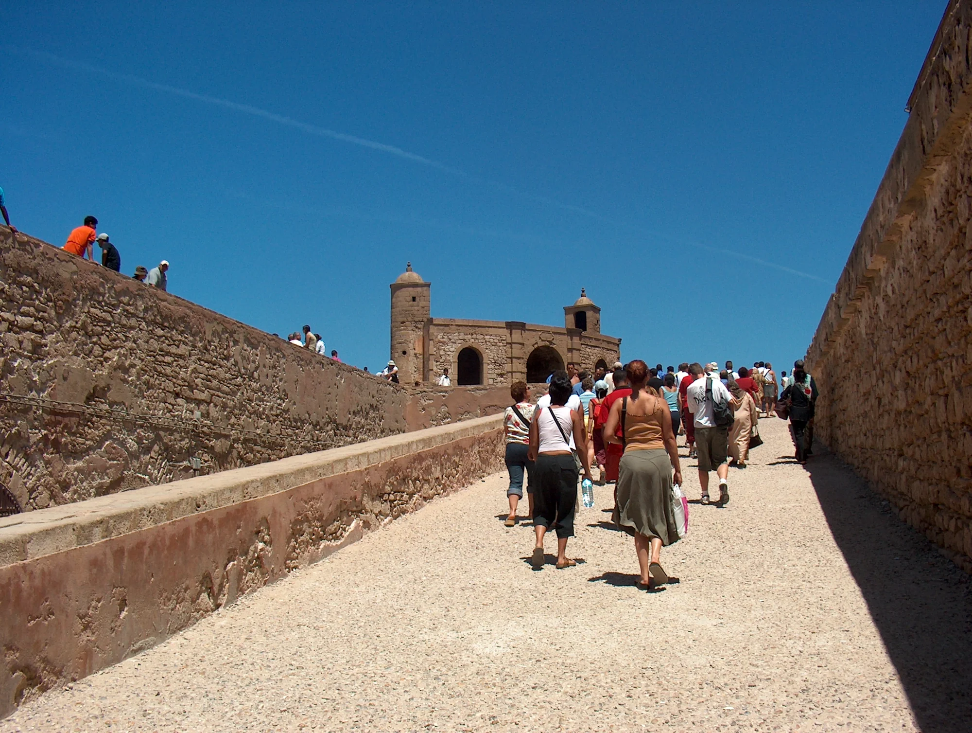 The Portuguese-era ramparts of Essaouira seen from the Atlantic at low tide, built on and from the limestone cliffs of the Moroccan Meseta.